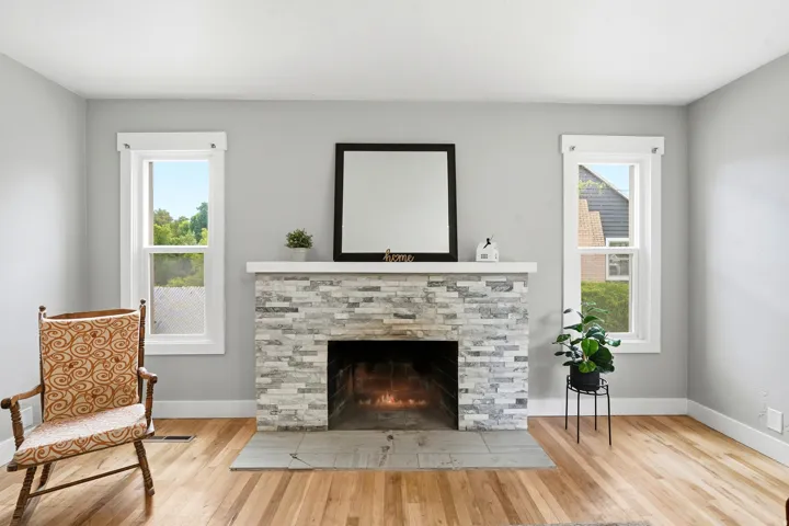 Stacked stone fireplace with a light-colored mantel