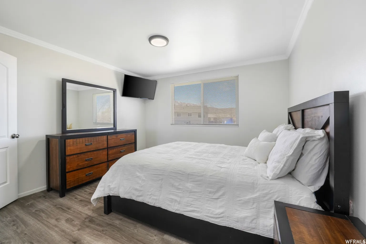 Bright room with light gray walls and wood-finish flooring