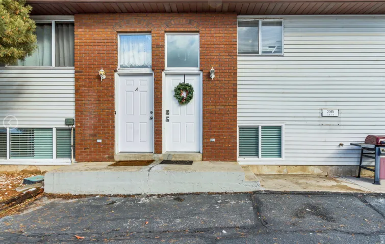 Two-story multi-unit dwelling with brick and siding exterior