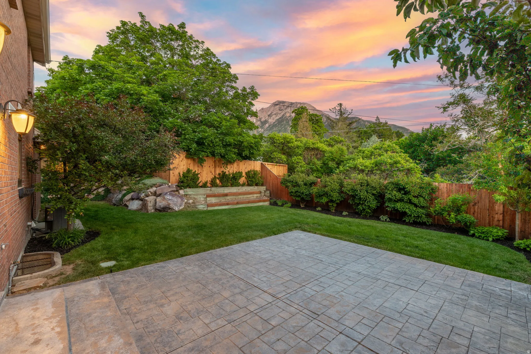 Private yard, large poured patio, with views of Mt. Olympus.