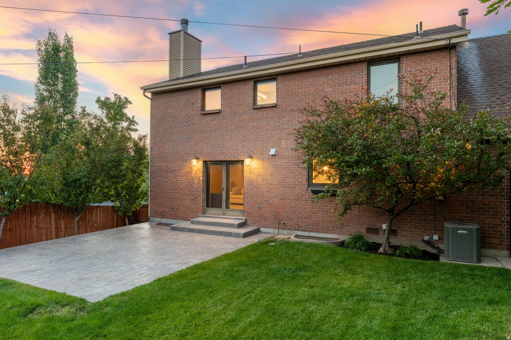 All-Brick exterior, private yard, large poured patio, beautiful and mature landscaping.