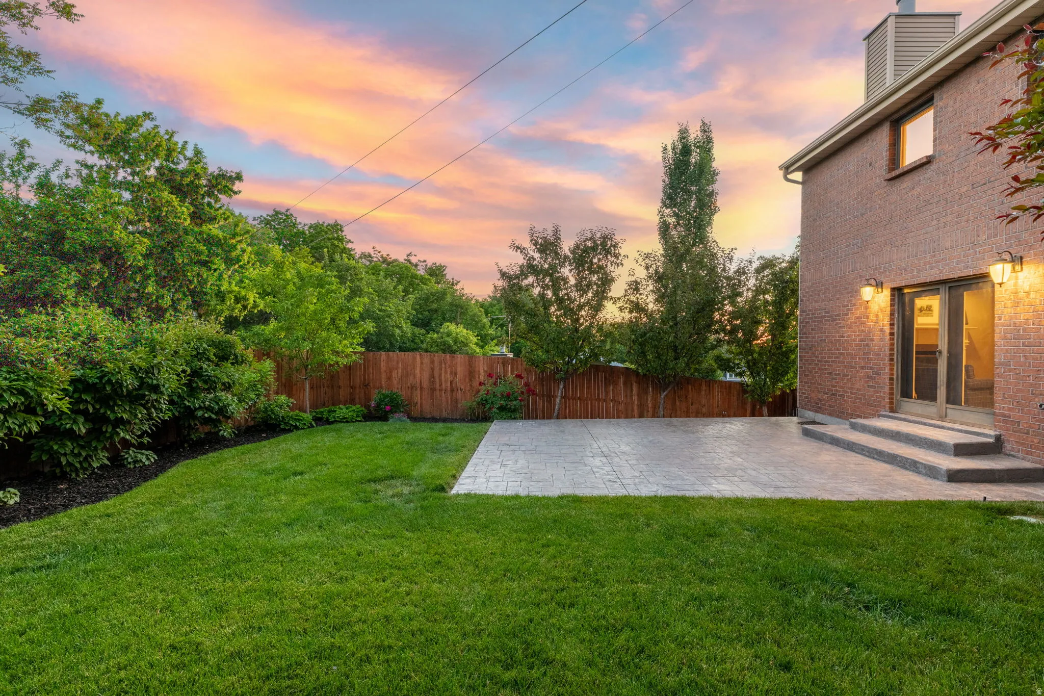 All-Brick exterior, private yard, large poured patio, beautiful and mature landscaping.