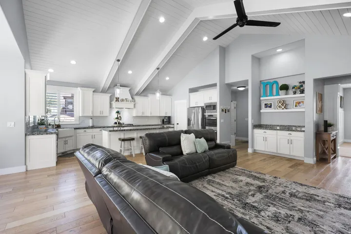Vaulted ceilings with wood-plank finish and recessed lighting
