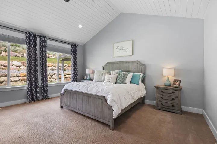 Vaulted ceiling with white plank paneling
