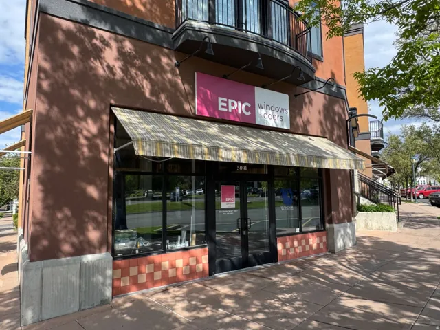 Commercial storefront with a striped awning and large display windows