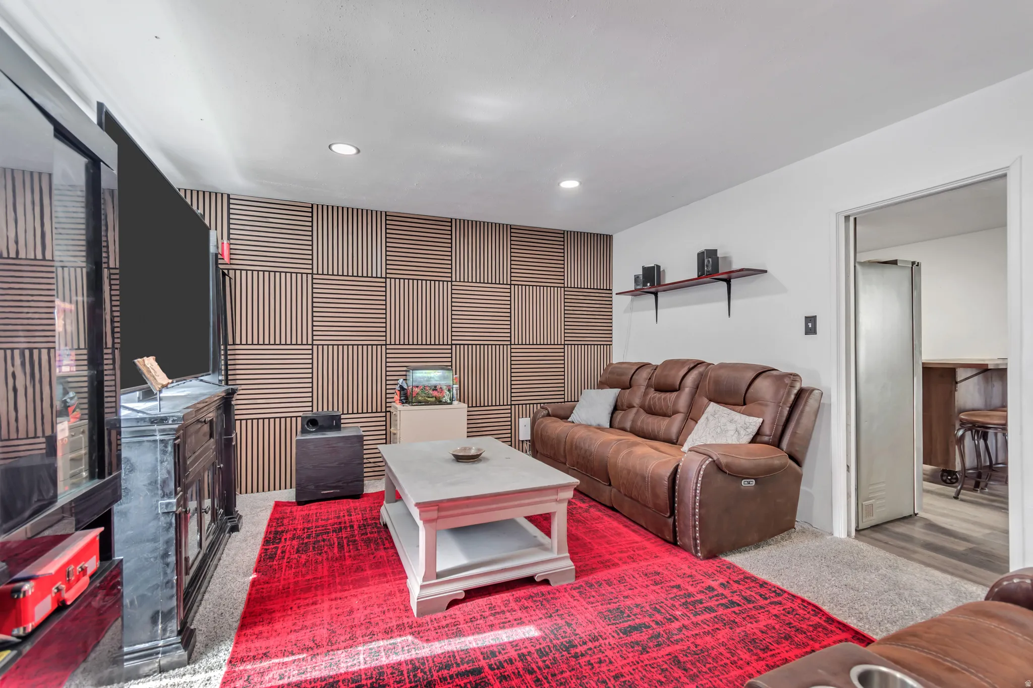 Accent wall featuring a geometric wood-panel design