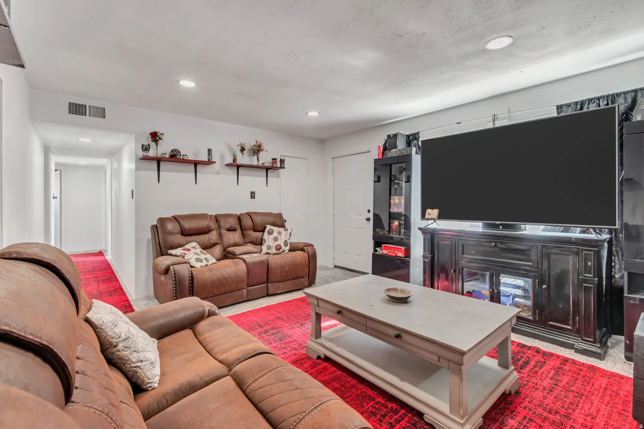 Recessed ceiling lighting illuminates this living space
