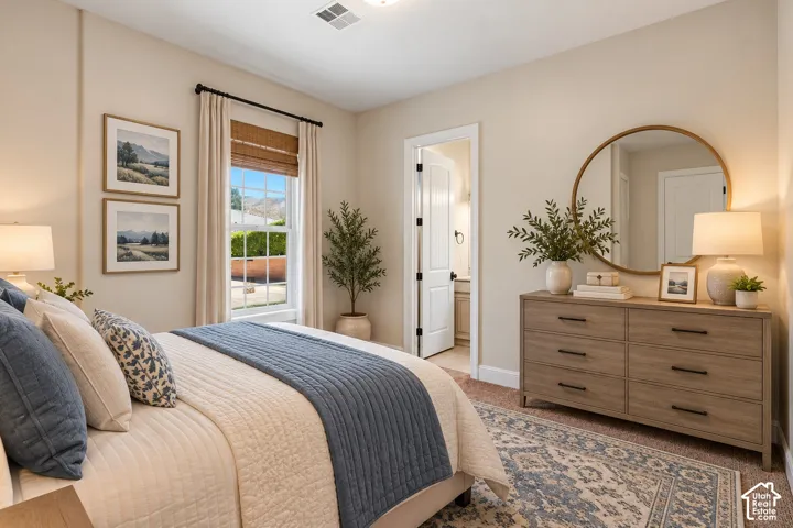 Neutral-toned room featuring a single-hung window with a grid pattern, a solid-core interior door with matte black hardware, and carpeted flooring