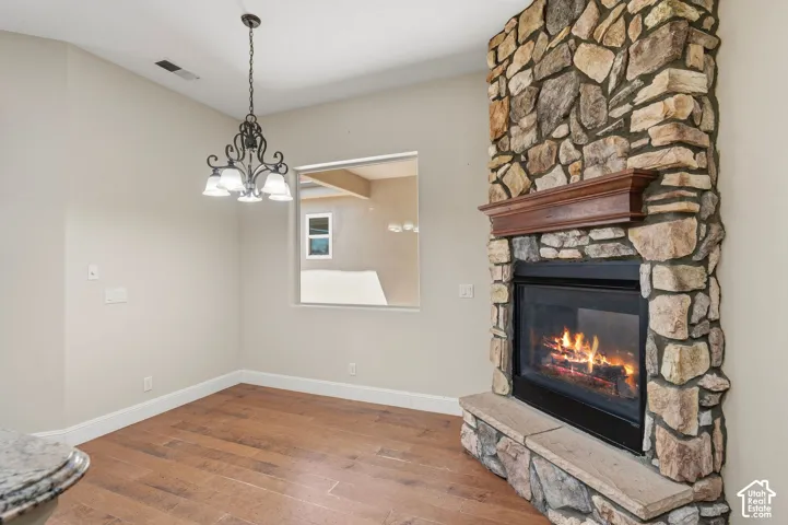 Stone-clad fireplace with a wood mantel
