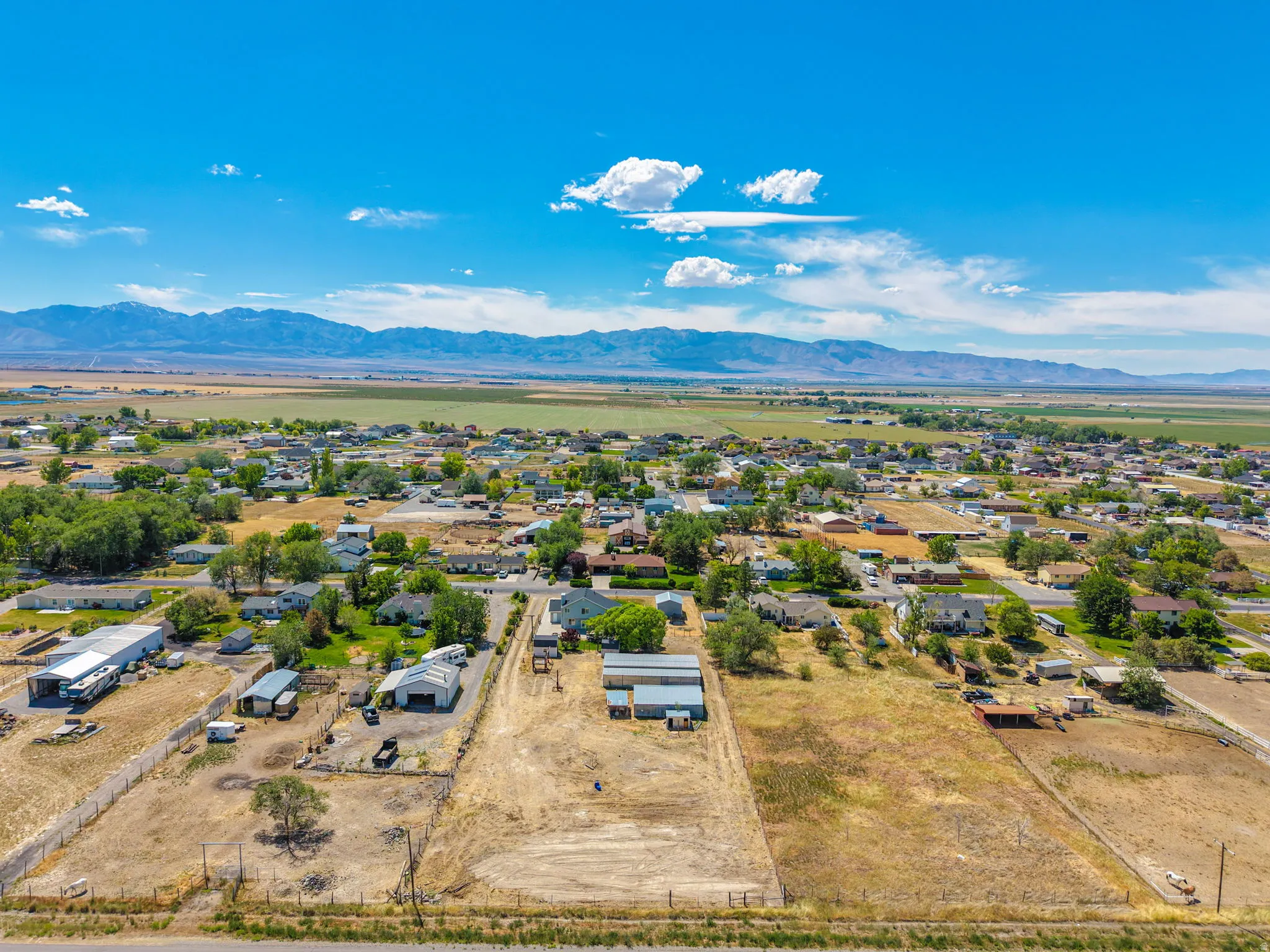 Aerial perspective showcasing extensive land parcels and surrounding residential areas