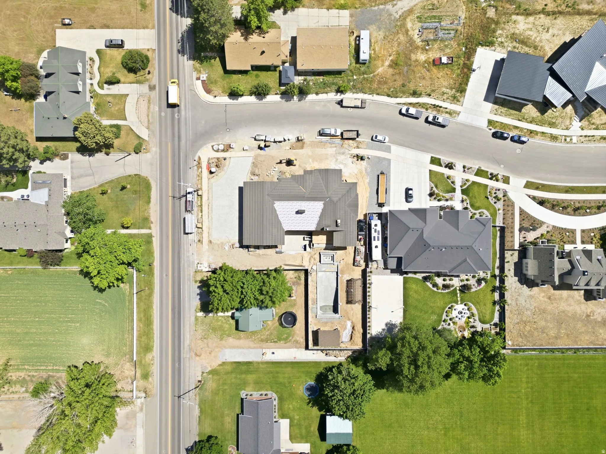 Aerial perspective of a developing residential area with a prominent corner lot