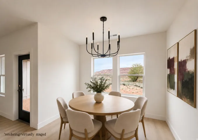 Open concept space with wood-finish flooring, a contemporary black chandelier, and multiple windows
