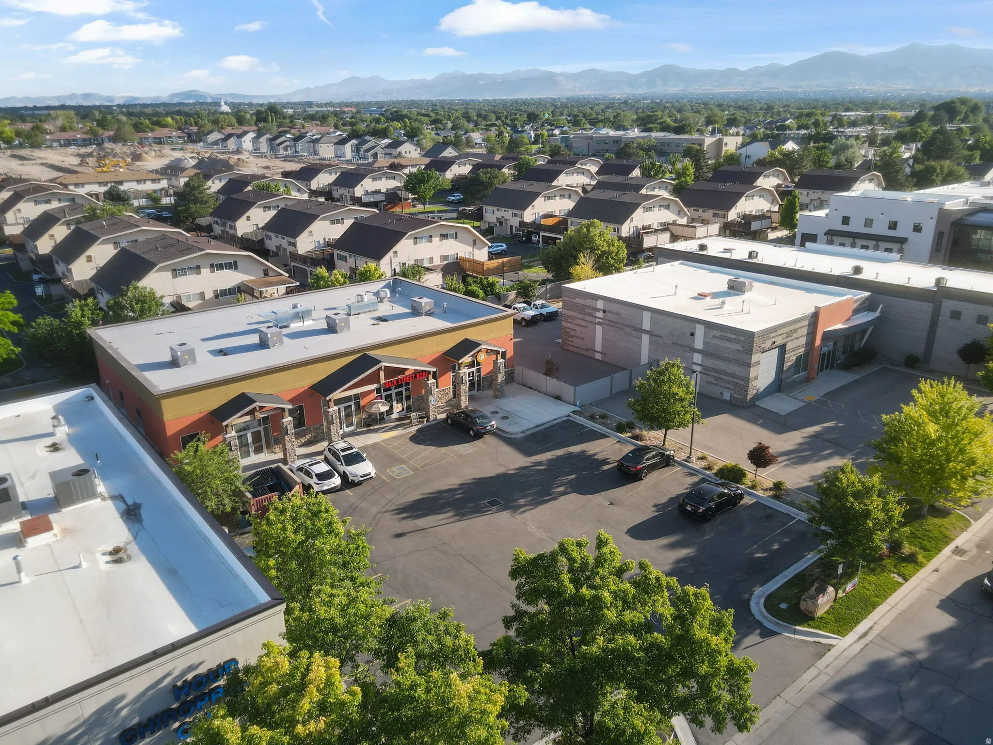 Commercial building featuring a flat roof and a structured facade with multiple entrances
