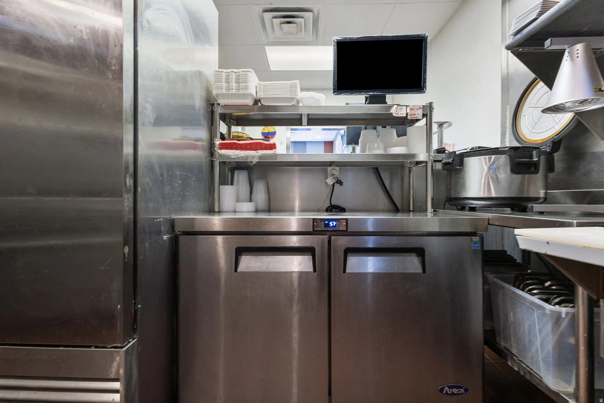 Stainless steel undercounter refrigerator with two pull-out doors and digital temperature display