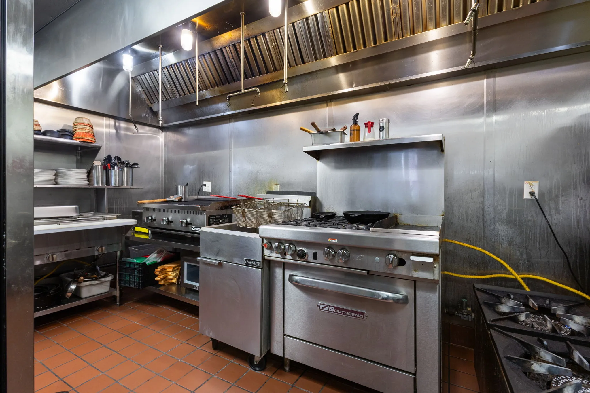 Commercial kitchen featuring stainless steel walls and fixtures