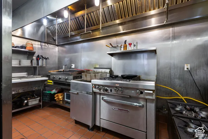Commercial kitchen featuring stainless steel walls and fixtures