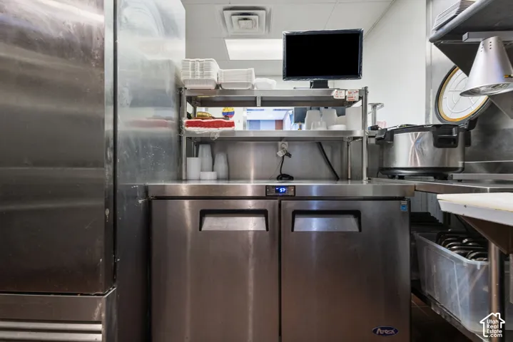 Stainless steel undercounter refrigerator with two pull-out doors and digital temperature display