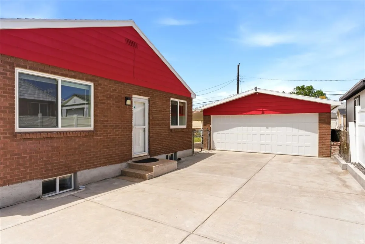 Brick exterior with a vibrant red gable accent