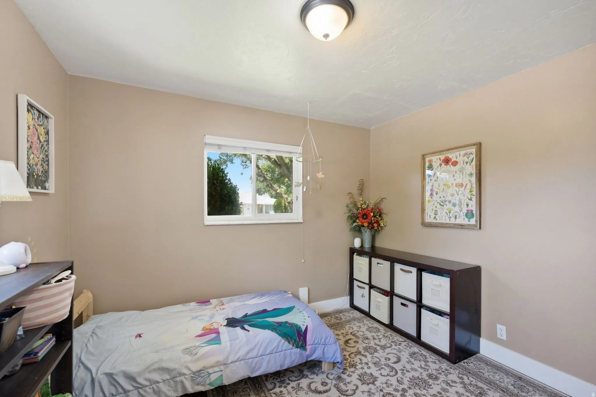 Neutral tone walls, white trim, and a window providing natural illumination