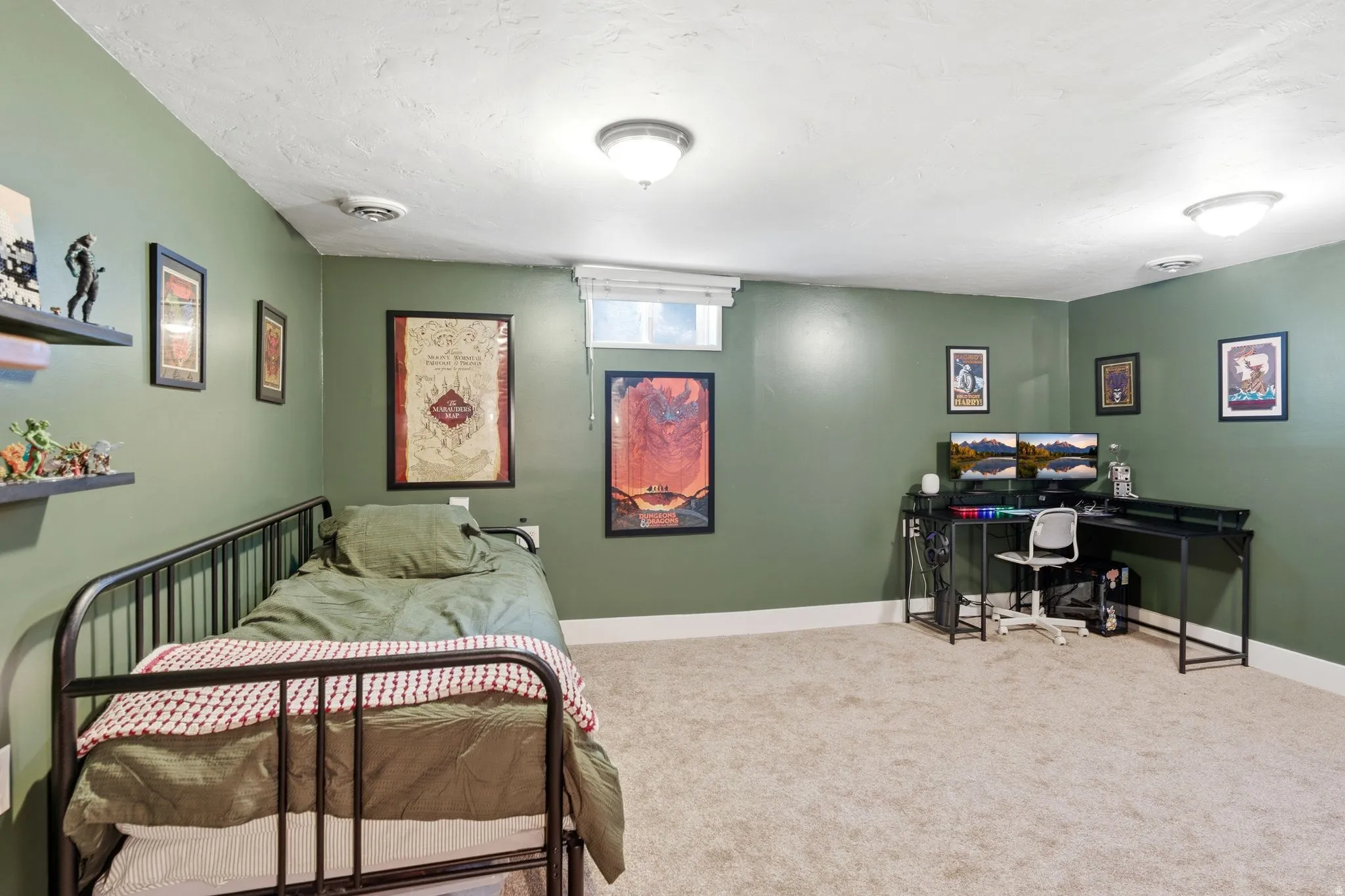 Carpeted room with sage green walls and white trim