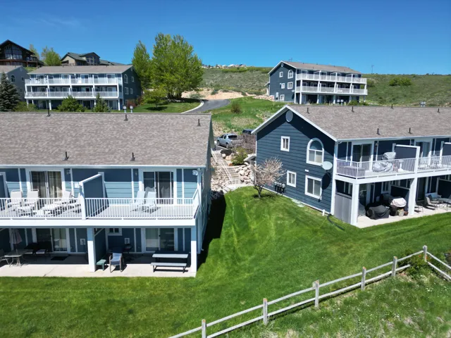 Multi-level property featuring a blue exterior and light-colored trim