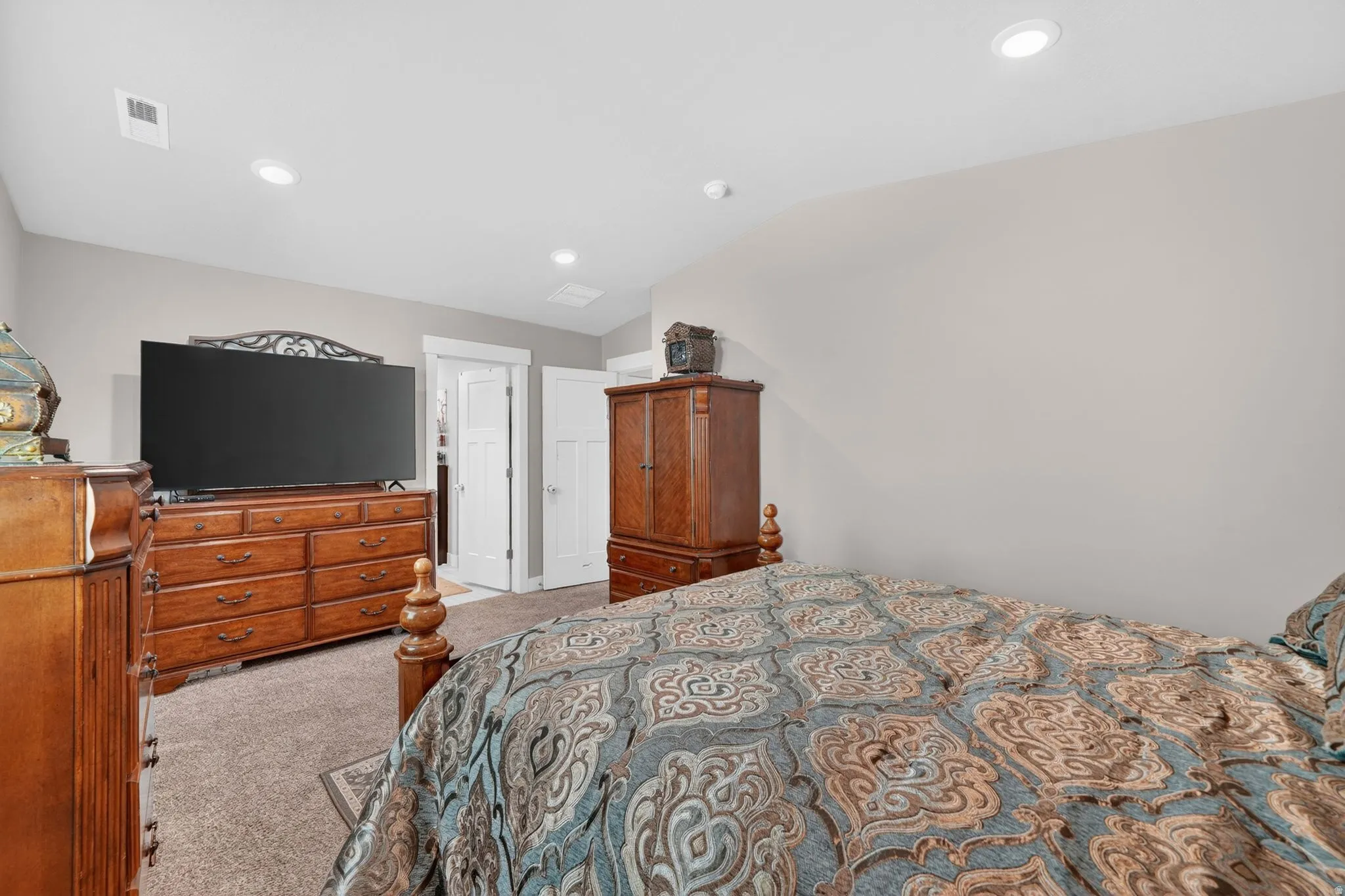 Recessed lighting illuminates neutral-toned walls