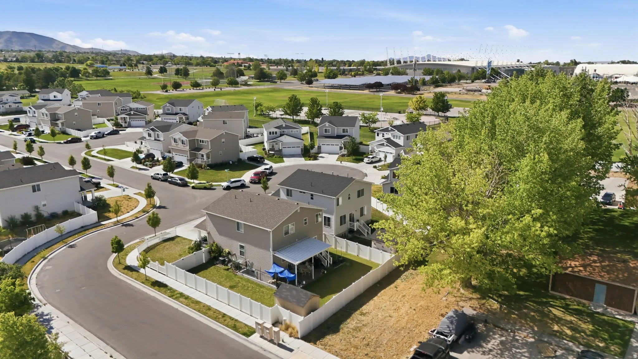Residential neighborhood featuring paved streets and manicured green spaces