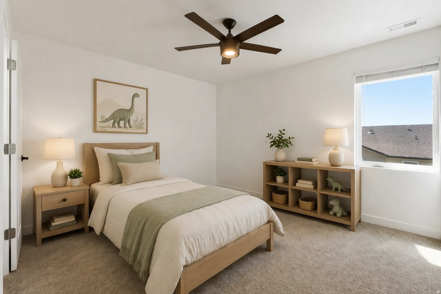 Carpeted room featuring a ceiling fan with integrated lighting, a window with a white frame, and a white interior door with a black handle