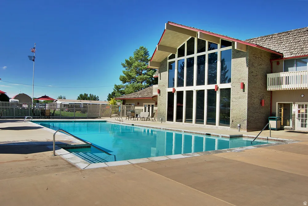 Outdoor swimming pool with concrete decking