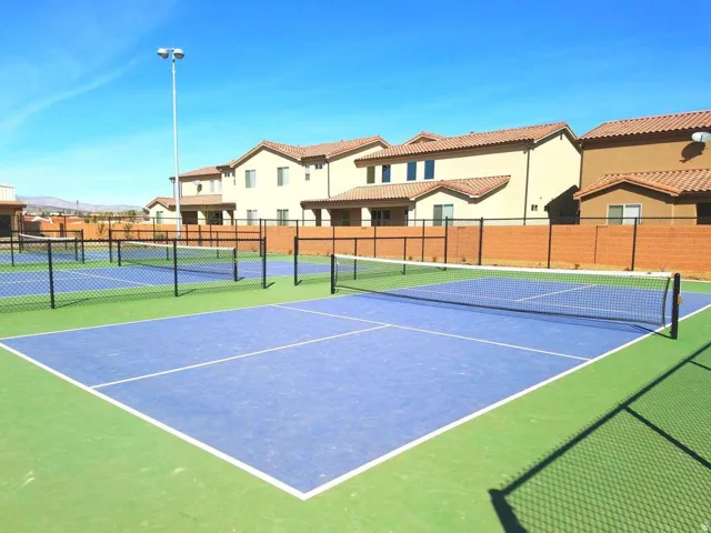 Sport court featuring blue and green surfacing