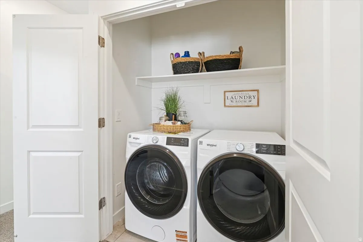 The laundry is conveniently located upstairs by the bedrooms.