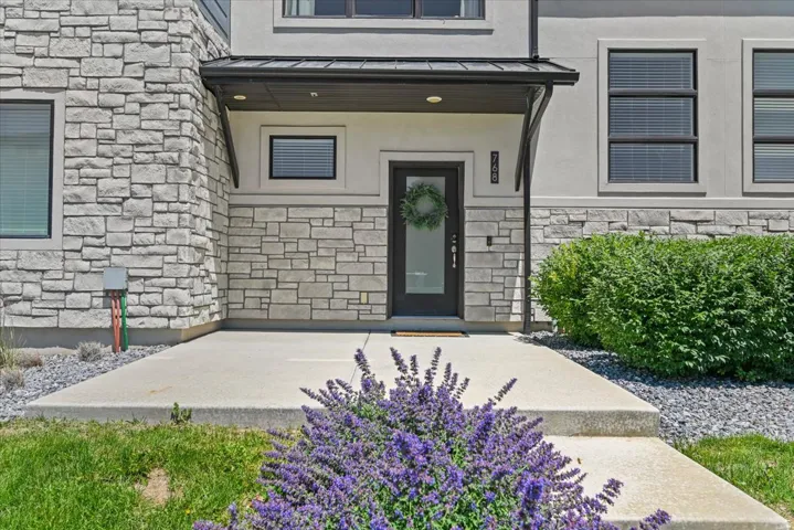 Large front porch, with a great view of the community park across the street.