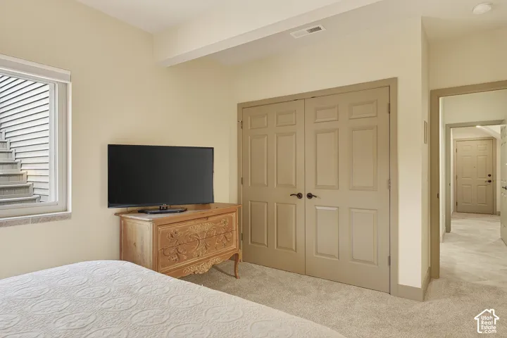 Plush carpeting and paneled double doors characterize this interior space