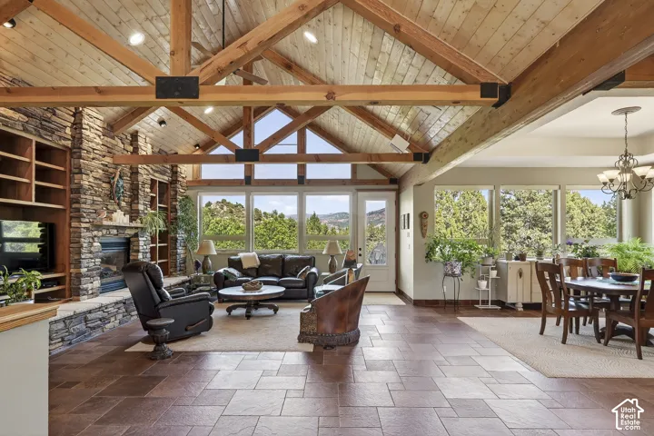 Vaulted wood plank ceilings with exposed beams define this expansive room