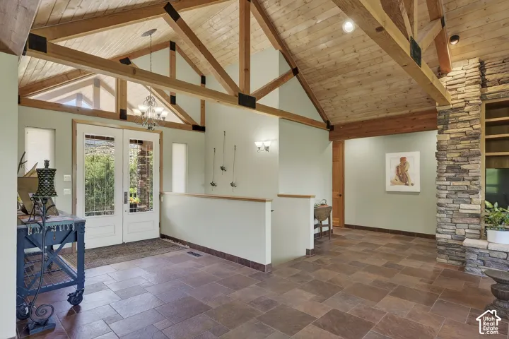 Vaulted wood-plank ceiling with exposed timber beams