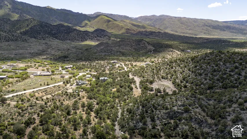 Expansive desert landscape with rolling hills and distant mountains