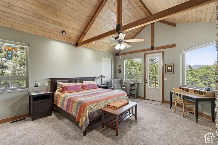 Vaulted wood-paneled ceiling with exposed beams