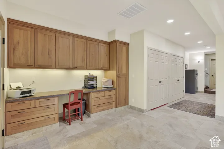 Built-in wooden cabinetry with under-cabinet lighting