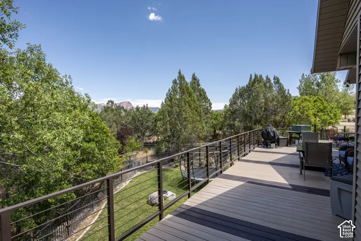 Expansive outdoor deck with composite decking and cable railing