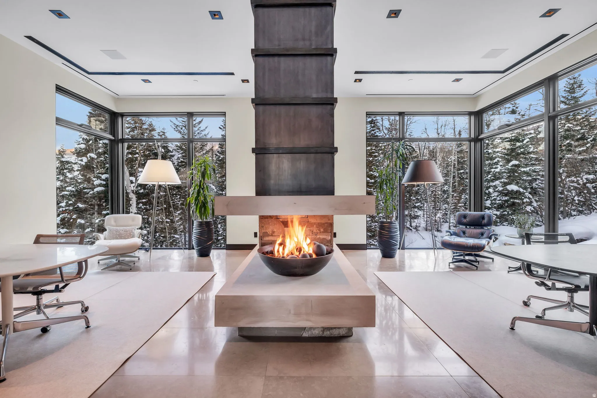 Central fireplace feature with an elevated hearth and integrated fire bowl