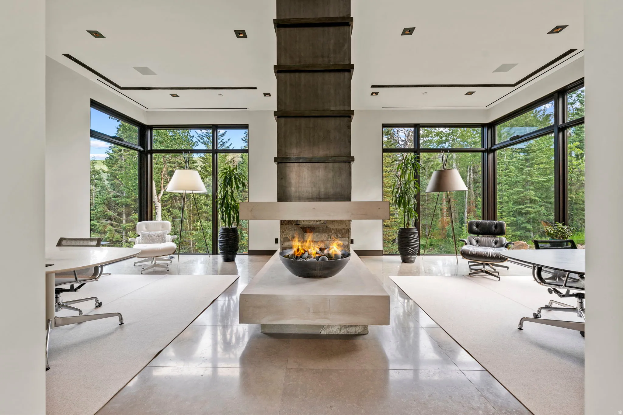 Central gas fire pit feature on a stone plinth