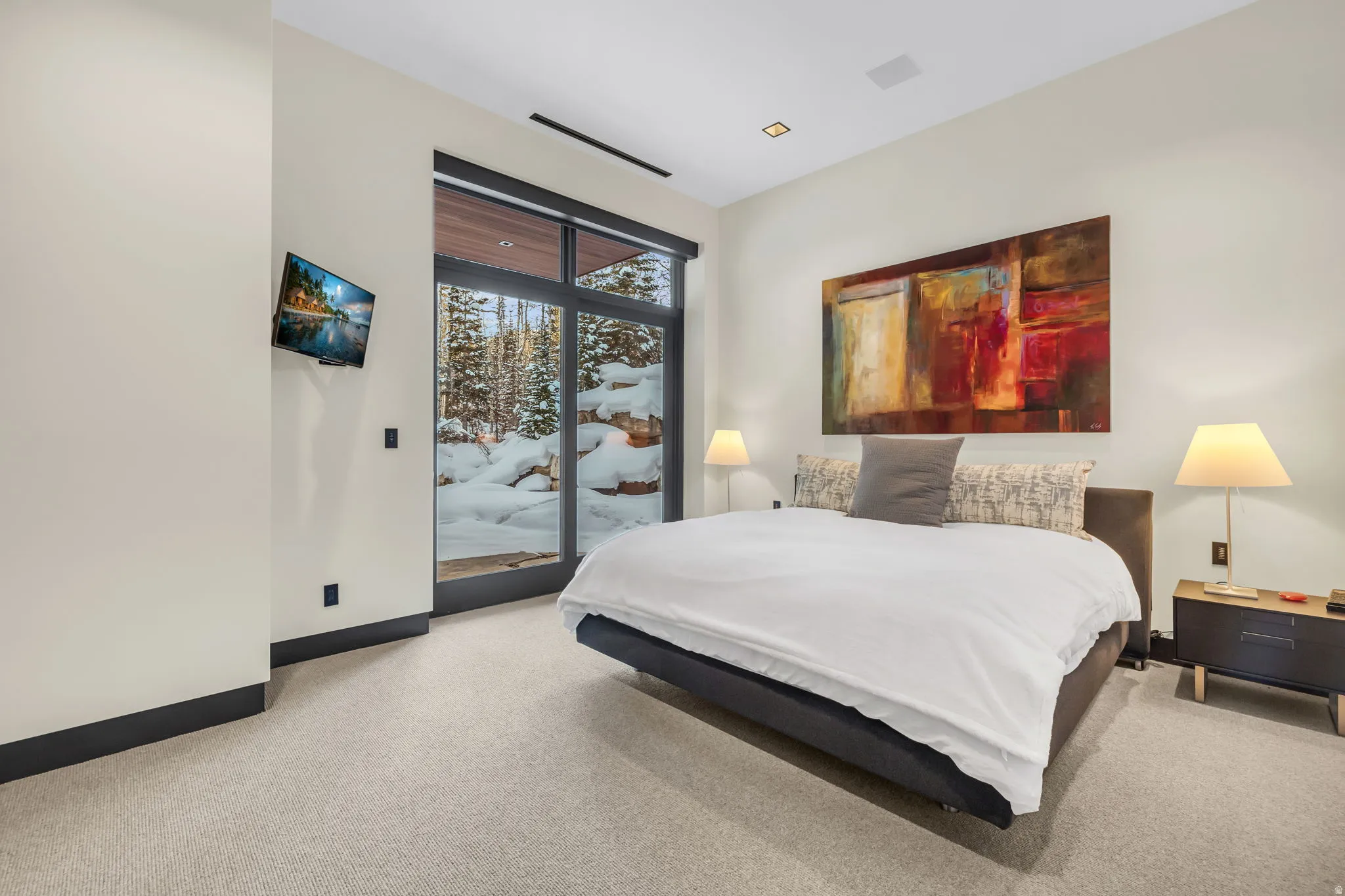 Bedroom featuring large format glass doors, recessed lighting, and light-toned carpeting