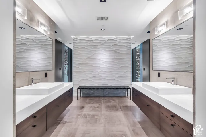 Dual floating vanities with integrated rectangular sinks and contemporary chrome faucets