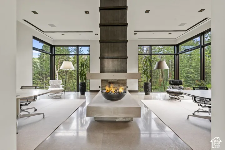 Central gas fire pit feature on a stone plinth