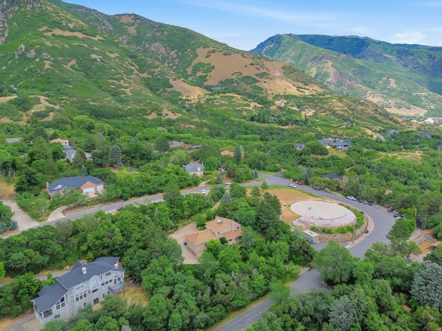Lush, mountainous terrain surrounds this residential area