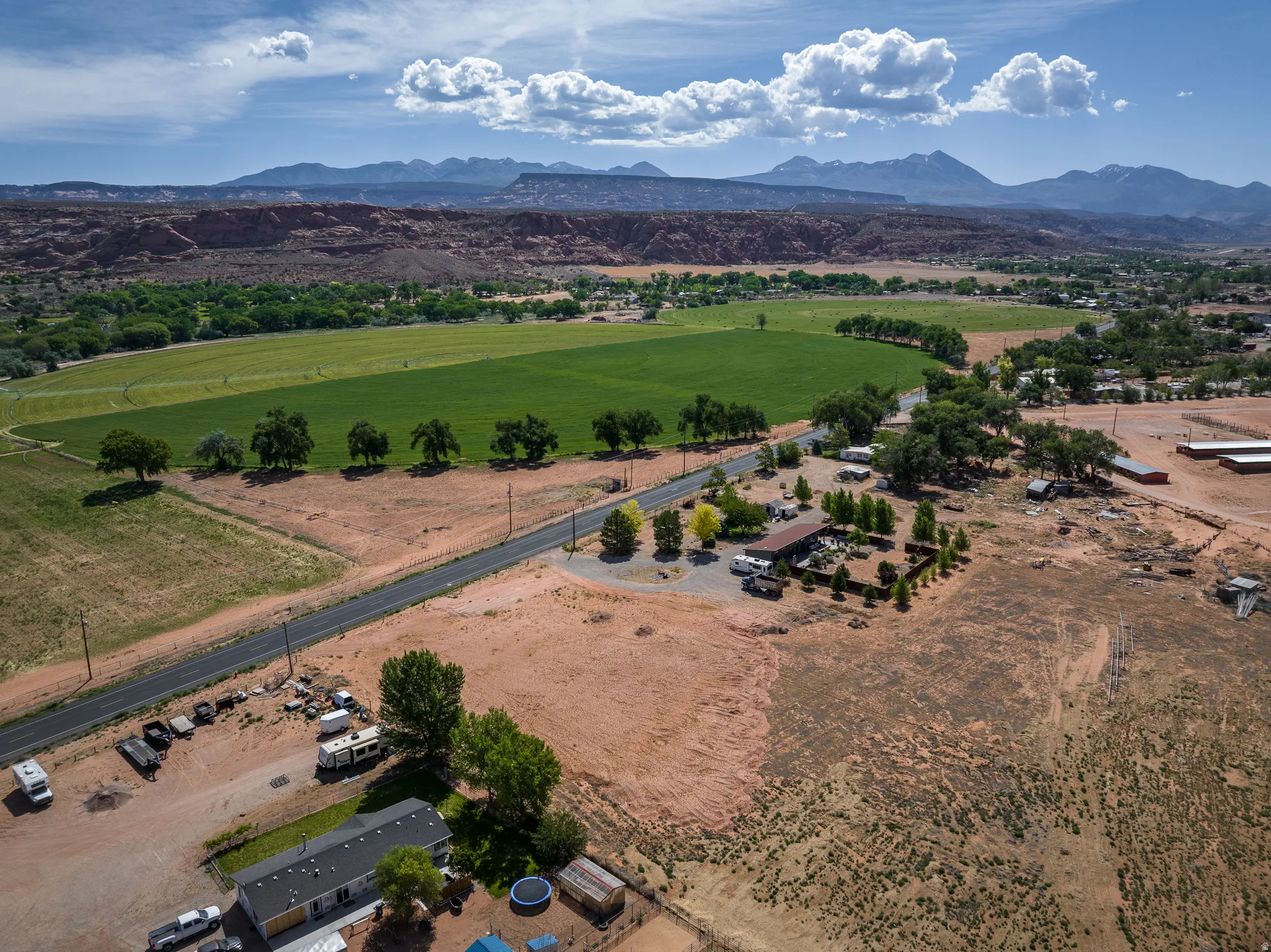 Expansive agricultural fields with distant mountain ranges