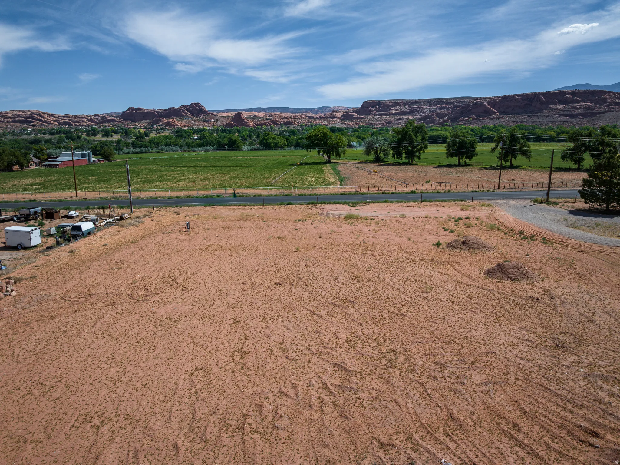Expansive undeveloped land parcel featuring a gravel access point
