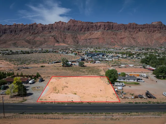 Expansive undeveloped parcel featuring a flat, cleared building area