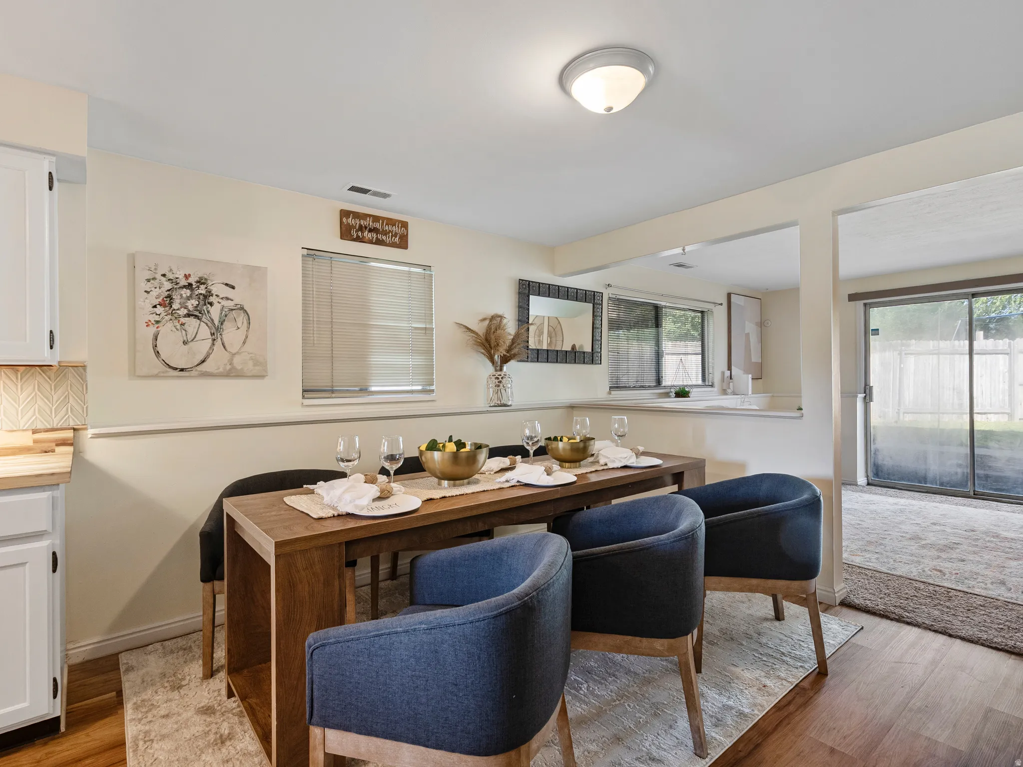Dining area featuring a wood-finish floor and neutral wall tones