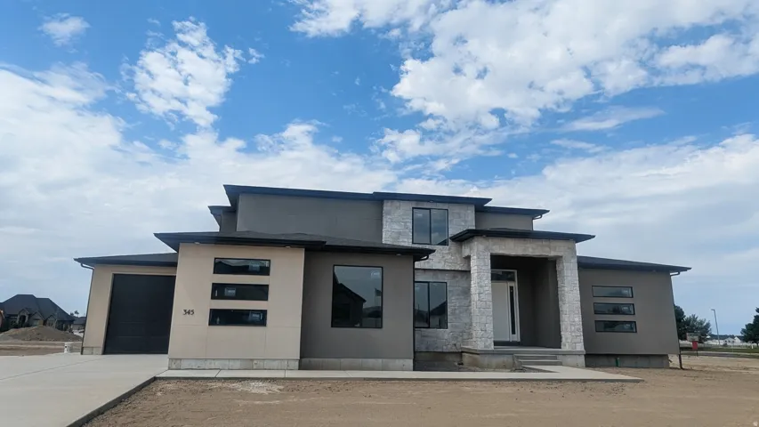 Contemporary exterior featuring multiple rooflines and a neutral color palette